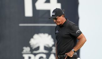 Phil Mickelson walks off the 14th green after missing a birdie putt during the third round at the PGA Championship golf tournament on the Ocean Course, Saturday, May 22, 2021, in Kiawah Island, S.C. (AP Photo/David J. Phillip, File)