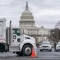 Heavy vehicles, including garbage trucks and snow plows, are set near the entrance to Capitol Hill at Pennsylvania Avenue and 3rd Street NW in Washington, Tuesday, Feb. 22, 2022, amid reports that trucker protests will arrive on March 1, the day of President Joe Biden&#39;s State of the Union address. (AP Photo/J. Scott Applewhite)