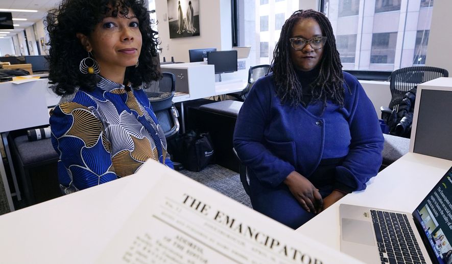 Amber Payne, left, and Deborah Douglas co-editors-in-chief of the new online publication of &amp;quot;The Emancipator&amp;quot; pose at their office inside the Boston Globe, Wednesday, Feb. 2, 2022, in Boston. Boston University&#x27;s Center for Antiracist Research and The Boston Globe&#x27;s Opinion team are collaborating to resurrect and reimagine The Emancipator, the first abolitionist newspaper in the United States, which was founded more than 200 years ago. The new incarnation of The Emancipator will explore ways to reframe the national conversation around racial injustice. (AP Photo/Charles Krupa)