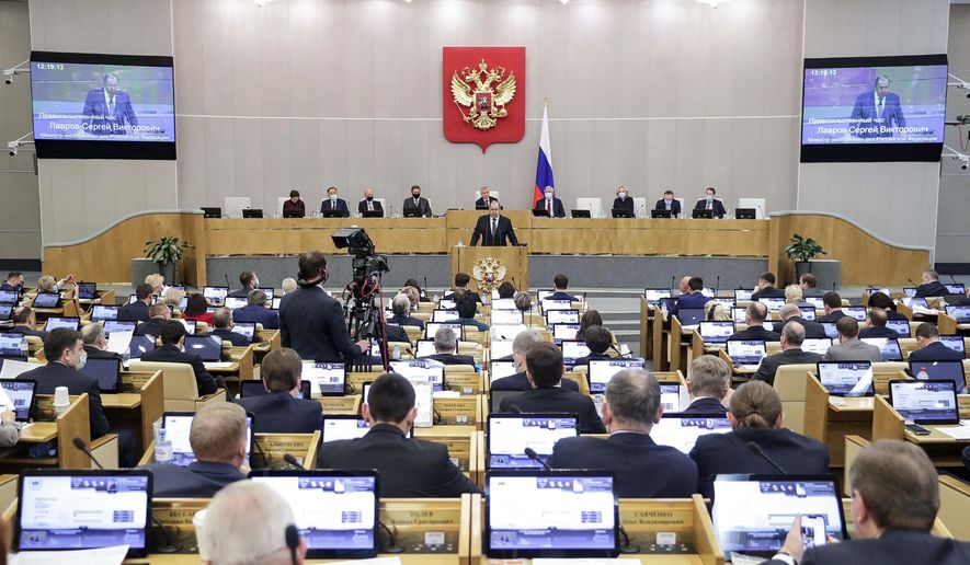 In this handout photo released by The State Duma, The Federal Assembly of The Russian Federation Press Service, Russian Foreign Minister Sergey Lavrov addresses the State Duma, the Lower House of the Russian Parliament in Moscow, Russia, Wednesday, Jan. 26, 2022. (The State Duma, The Federal Assembly of The Russian Federation Press Service via AP)