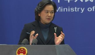 Chinese Foreign Ministry spokesperson Hua Chunying reacts during the daily press conference held at the Foreign Ministry on Thursday, Feb. 24, 2022, in Beijing. China’s customs agency on Thursday approved imports of wheat from all regions of Russia, a move that could help to reduce the impact of possible Western sanctions imposed over Moscow’s attack on Ukraine. (AP Photo/Liu Zheng)