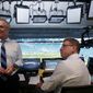 FILE - Fox Sports play-by-play announcer Joe Buck, left, and analyst Troy Aikman work in the broadcast booth before a preseason NFL football game between the Miami Dolphins and Jacksonville Jaguars in Miami Gardens, Fla., Aug. 22, 2019. Aikman is on the verge of leaving Fox after 22 years to become the lead analyst on ESPN&#39;s Monday Night Football. The New York Post reported that Aikman will sign a five-year deal that would rival the $17.5 million per year Tony Romo is making at CBS. (AP Photo/Lynne Sladky, File)
