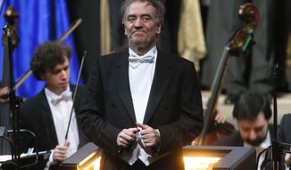 FILE - In this Wednesday, May 1, 2013 photo, Valery Gergiev, looks on after a &amp;quot;pre-premiere&amp;quot; performance, put on for veterans and senior employees of the theatre in the new Mariinsky Theatre on the eve of the it&#39;s official opening in St.Petersburg, Russia.  Gergiev, a conductor who is close to Russia President Vladimir Putin, will not lead the Vienna Philharmonic in a five-concert U.S. tour that starts at Carnegie Hall on Friday night. The 68-year-old Russian conductor is music director of the Mariinsky Theatre in St. Petersburg, Russia, the White Nights Festival there and is chief conductor of the Munich Philharmonic. He received a Hero of Labor of the Russian Federation prize that Putin revived in 2013. Metropolitan Opera music director Yannick Nézet-Séguin will replace Gergiev for the Carnegie concerts. (AP Photo/Dmitry Lovetsky, File)