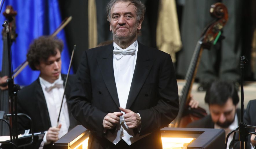 FILE - In this Wednesday, May 1, 2013 photo, Valery Gergiev, looks on after a "pre-premiere" performance, put on for veterans and senior employees of the theatre in the new Mariinsky Theatre on the eve of the it's official opening in St.Petersburg, Russia. Gergiev, a conductor who is close to Russia President Vladimir Putin, will not lead the Vienna Philharmonic in a five-concert U.S. tour that starts at Carnegie Hall on Friday night. The 68-year-old Russian conductor is music director of the Mariinsky Theatre in St. Petersburg, Russia, the White Nights Festival there and is chief conductor of the Munich Philharmonic. He received a Hero of Labor of the Russian Federation prize that Putin revived in 2013. Metropolitan Opera music director Yannick Nézet-Séguin will replace Gergiev for the Carnegie concerts. (AP Photo/Dmitry Lovetsky, File)
