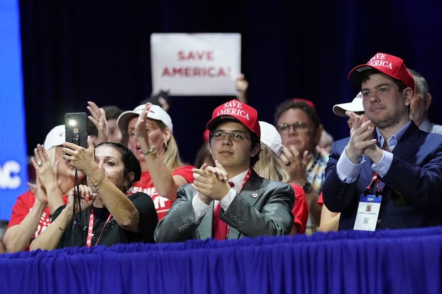 Supporters applaud as former President Donald Trump speaks at the Conservative Political Action Conference (CPAC) Saturday, Feb. 26, 2022, in Orlando, Fla. (AP Photo/John Raoux)