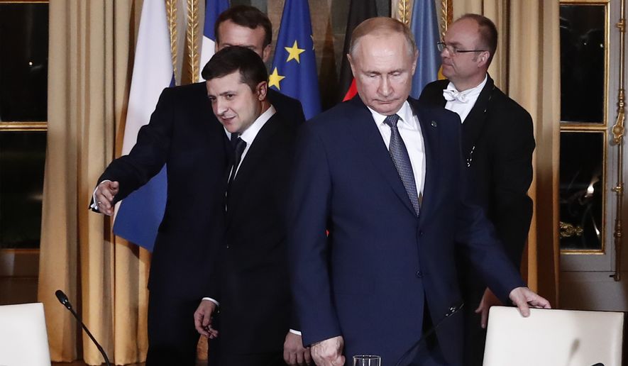Russian President Vladimir Putin, right, and Ukrainian President Volodymyr Zelenskyy arrive for a working session at the Elysee Palace, Dec. 9, 2019, in Paris. (Ian Langsdon/Pool via AP, File)