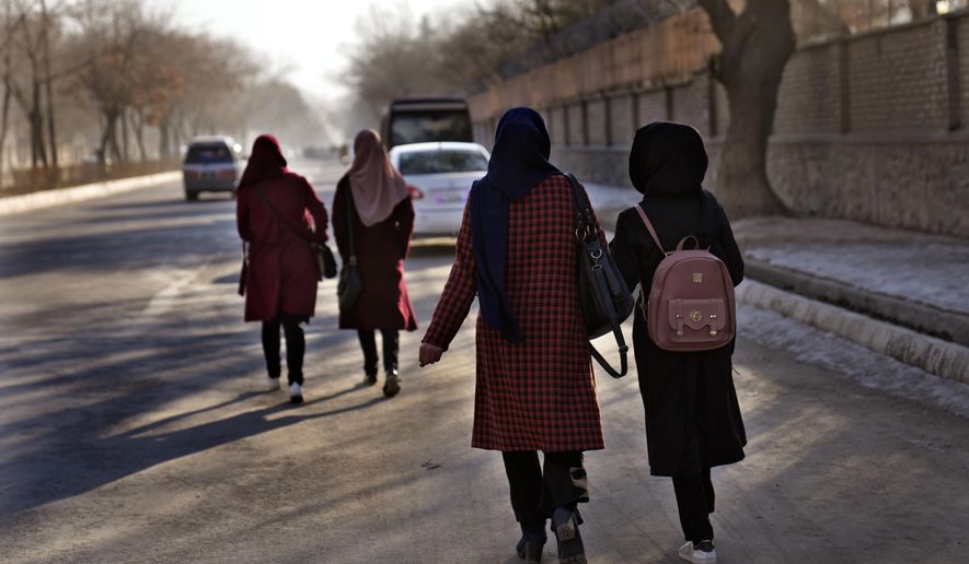 Afghan students walk toward their university in Kabul, Afghanistan, Saturday, Feb. 26, 2022.  (AP Photo/Hussein Malla) ** FILE **