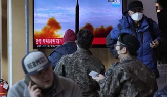 People watch a TV showing a file image of North Korea&#39;s missile launch during a news program, at the Seoul Railway Station in Seoul, South Korea, Sunday, Feb. 27, 2022. North Korea on Sunday launched a suspected ballistic missile into the sea, South Korean and Japanese officials said, in an apparent resumption of its weapons tests following the end of the Winter Olympics in China, the North&#39;s last major ally and economic pipeline. (AP Photo/Ahn Young-joon)