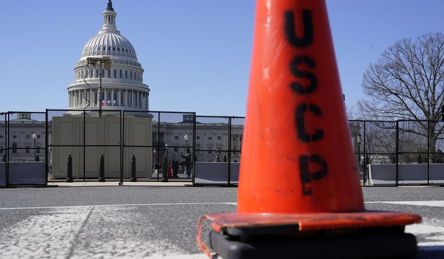 A security fence put in place in preparation for President Joe Biden&#39;s State of the Union address surrounds the U.S. Capitol building on Capitol Hill in Washington, Sunday, Feb. 27, 2022. (AP Photo/Patrick Semansky)