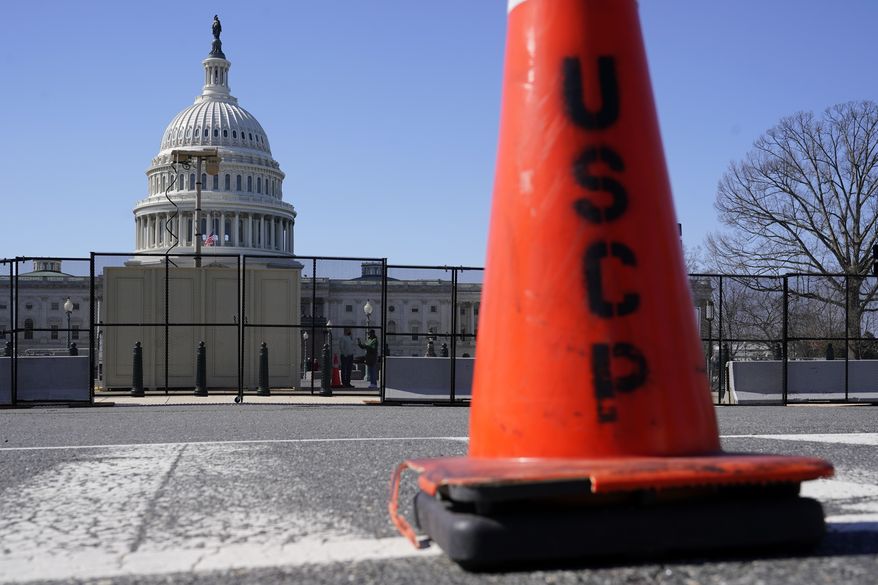 A security fence put in place in preparation for President Joe Biden's State of the Union address surrounds the U.S. Capitol building on Capitol Hill in Washington, Sunday, Feb. 27, 2022. (AP Photo/Patrick Semansky)
