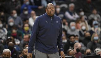 Georgetown head coach Patrick Ewing reacts during the second half of an NCAA college basketball game against Connecticut, Sunday, Feb. 27, 2022, in Washington. Connecticut won 86-77. (AP Photo/Nick Wass)