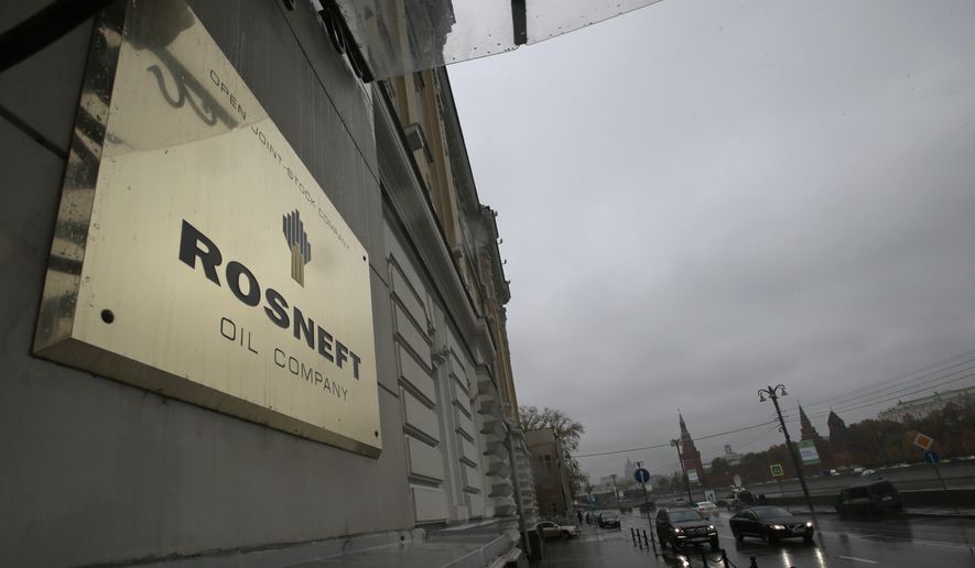 In this Oct. 18, 2012 file photo, a plaque of Rosneft is seen outside its headquarters in Moscow, Russia. House Speaker Nancy Pelosi on has endorsed a growing bipartisan movement on Capitol Hill for the U.S. to ban Russian oil imports. (AP Photo/Mikhail Metzel)  **FILE**