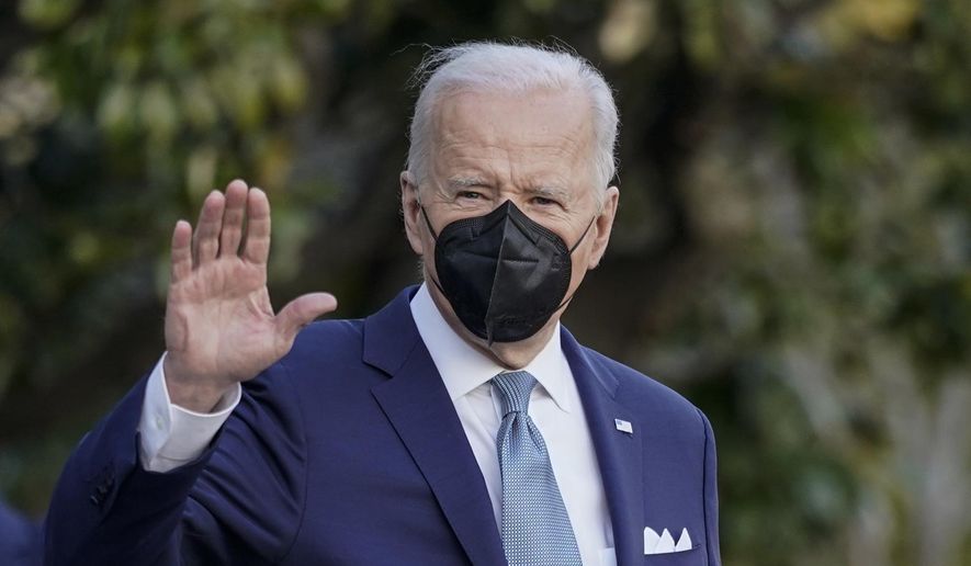 President Joe Biden waves as he walks with first lady Jill Biden to board Maine One at the White House in Washington, Friday, Feb. 25, 2022, en route to Wilmington, Del. (AP Photo/Carolyn Kaster)