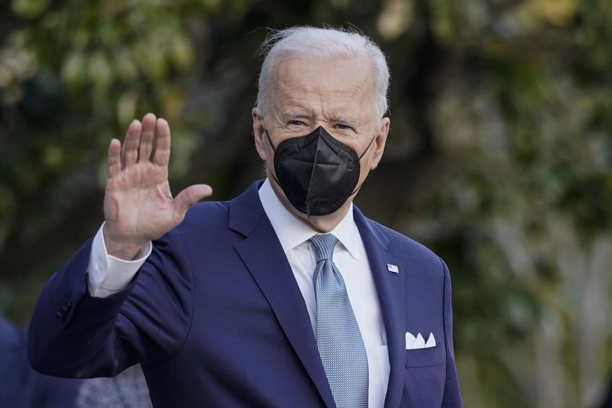 President Joe Biden waves as he walks with first lady Jill Biden to board Maine One at the White House in Washington, Friday, Feb. 25, 2022, en route to Wilmington, Del. (AP Photo/Carolyn Kaster)