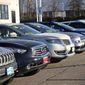 Used vehicles sit in a storage lot at a Toyota dealership Sunday, Feb. 27, 2022, in Englewood, Colo. (AP Photo/David Zalubowski)