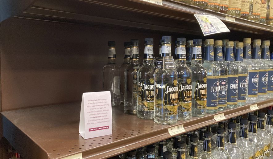 A shelf is emptied of Russian Standard Vodka at a Fine Wine & Good Spirits liquor store in Dresher, Pa., Monday, Feb. 28, 2022. Pennsylvania ordered the removal of Russian-made products from state-owned liquor stores. (AP Photo/Matt Rourke)