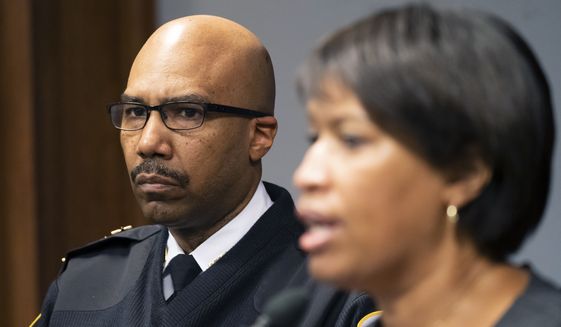Washington Metropolitan Police Chief Robert Contee III, left, listens as Washington Mayor Muriel Bowser discusses preparations for the 2022 State of the Union Address during a news conference, Monday, Feb. 28, 2022, in Washington. (AP Photo/Alex Brandon) ** FILE **