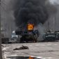 A Russian armored personnel carrier burns amid damaged and abandoned light utility vehicles after fighting in Kharkiv, Ukraine, Sunday, Feb. 27, 2022. The city authorities said that Ukrainian forces engaged in fighting with Russian troops that entered the country&#39;s second-largest city on Sunday. (AP Photo/Marienko Andrew)