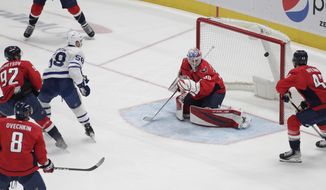 Toronto Maple Leafs&#39; Michael Bunting (58) scores a goal against Washington Capitals goalie Ilya Samsonov during the first period of an NHL hockey game Monday, Feb. 28, 2022, in Washington. (AP Photo/Luis M. Alvarez)