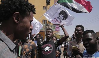 Sudanese protesters rally against the October 2021 military coup which has led to deaths and scores of arrests of demonstrators, in Khartoum, Sudan, Monday, Feb. 28, 2022. Since the coup, more than 80 people, mostly young men, have been killed and over 2,600 others injured in the protests, according to a Sudanese medical group. (AP Photo/Marwan Ali)