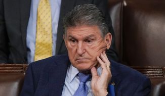 Sen. Joe Manchin, D-W.Va., listens as President Joe Biden delivers his first State of the Union address to a joint session of Congress, at the Capitol in Washington, Tuesday, March 1, 2022. (AP Photo/J. Scott Applewhite, Pool)