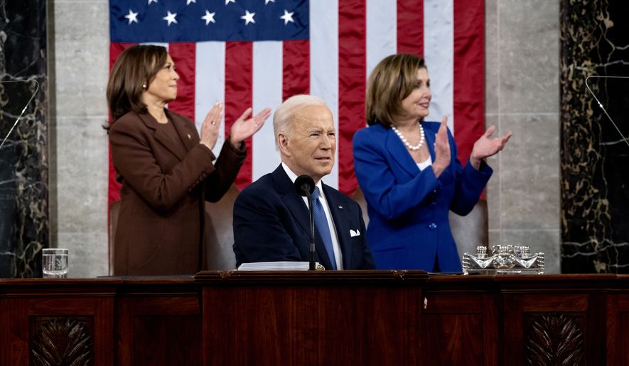 President Joe Biden delivers his State of the Union address to a joint session of Congress at the Capitol, Tuesday, March 1, 2022, in Washington, as Vice President Kamala Harris and Speaker of the House Nancy Pelosi look on. (Saul Loeb, Pool via AP)
