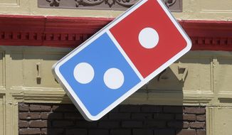 In this July 15, 2019, photo, a Domino&#x27;s location in Norwood, Mass., is shown. (AP Photo/Steven Senne) **FILE**