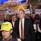 U.S. Rep. Lee Zeldin, center, walks to the stage before speaking to delegates and assembled party officials at the 2022 NYGOP Convention, Tuesday, March 1, 2022, in Garden City, N.Y. Republicans from across New York met Tuesday to choose their gubernatorial nominee to run against Gov. Kathy Hochul in November. The GOP nominated Zeldin, of Long Island, as the party&#x27;s designee for this year&#x27;s gubernatorial race.  (AP Photo/John Minchillo)