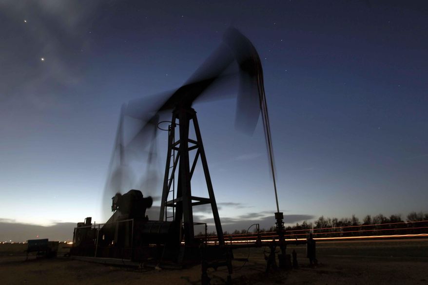 A pumping unit sucks oil from the ground near Greensburg, Kan. on March 6, 2012. (AP Photo/Charlie Riedel, File)