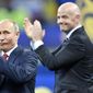 Russian President Vladimir Putin, left, applauds beside FIFA President Gianni Infantino at the end of the 2018 World Cup final soccer match between France and Croatia in the Luzhniki Stadium in Moscow, Russia, July 15, 2018. FIFA and UEFA have today decided together that all Russian teams, whether national representative teams or club teams, shall be suspended from participation in both FIFA and UEFA competitions until further notice. (AP Photo/Martin Meissner, File) **FILE**