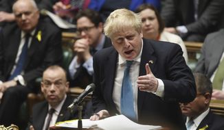 In this handout photo provided by UK Parliament, Britain&#39;s Prime Minister Boris Johnson speaks during weekly Prime Minister&#39;s Questions in the House of Commons in London, Wednesday, March 2, 2022. (Jessica Taylor/UK Parliament via AP)