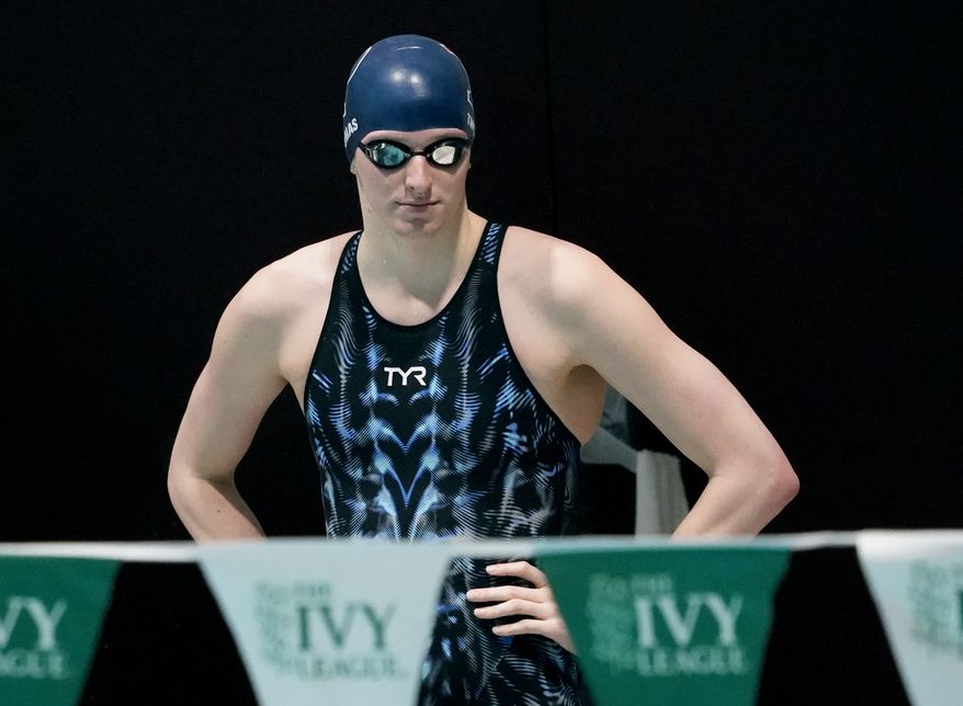 Pennsylvania&#39;s Lia Thomas looks on before swimming in a qualifying heat of the 500 yard freestyle event at the Ivy League Women&#39;s Swimming and Diving Championships at Harvard University, Thursday, Feb. 17, 2022, in Cambridge, Mass. (AP Photo/Mary Schwalm) ** FILE **