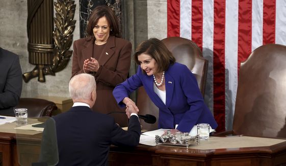 House speaker Nancy Pelosi of Calif., greets President Joe Biden as he arrives to deliver his first State of the Union address to a joint session of Congress at the Capitol, Tuesday, March 1, 2022, in Washington. Vice President Kamala Harris applauds at left. (Julia Nikhinson/Pool via AP)