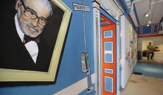 A mural that features Theodor Seuss Geisel, left, also known by his pen name Dr. Seuss, covers part of a wall near an entrance at The Amazing World of Dr. Seuss Museum, May 4, 2017, in Springfield, Mass. Sketches of fantastic creatures by Dr. Seuss that have never before been published will see the light of day in new books being written and illustrated by an inclusive group of up-and-coming authors and artists, the company that owns the intellectual property rights to Dr. Seuss&#39; works announced Wednesday, March 2, 2022. (AP Photo/Steven Senne, File)
