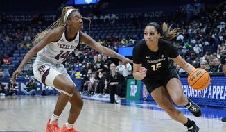 Vanderbilt&#39;s Brinae Alexander (15) drives against Texas A&amp;amp;M&#39;s Maliyah Johnson (14) in the first half of an NCAA college basketball game at the women&#39;s Southeastern Conference tournament Wednesday, March 2, 2019, in Nashville, Tenn. (AP Photo/Mark Humphrey) **FILE**