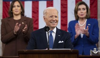 President Joe Biden delivers his first State of the Union address to a joint session of Congress at the Capitol, as Vice President Kamala Harris and House Speaker Nancy Pelosi of Calif., watch, Tuesday, March 1, 2022, in Washington. (Saul Loeb/Pool via AP)