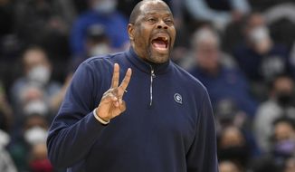 Georgetown head coach Patrick Ewing gestures during the second half of an NCAA college basketball game against Connecticut, Sunday, Feb. 27, 2022, in Washington. Connecticut won 86-77. (AP Photo/Nick Wass)