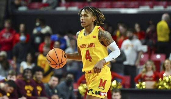 Maryland guard Fatts Russell (4) brings the ball up court during the second half of an NCAA college basketball game against Minnesota, Wednesday, March 2, 2022, in College Park, Md. (AP Photo/Terrance Williams) **FILE**
