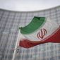 File - A national flag of Iran waves in front of the building of the International Atomic Energy Agency, IAEA, in Vienna, Austria, Friday, Dec. 17, 2021. The United Nations’ atomic watchdog says it believes that Iran has further increased its stockpile of highly enriched uranium in breach of a 2015 accord with world powers. The International Atomic Energy Agency told member nations in its confidential quarterly report Thursday that Iran has an estimated stock of 33.2 kilograms (73.1 pounds) of uranium enriched to up to 60% fissile purity, an increase of 15.5 kilograms since November. (AP Photo/Michael Gruber, File)