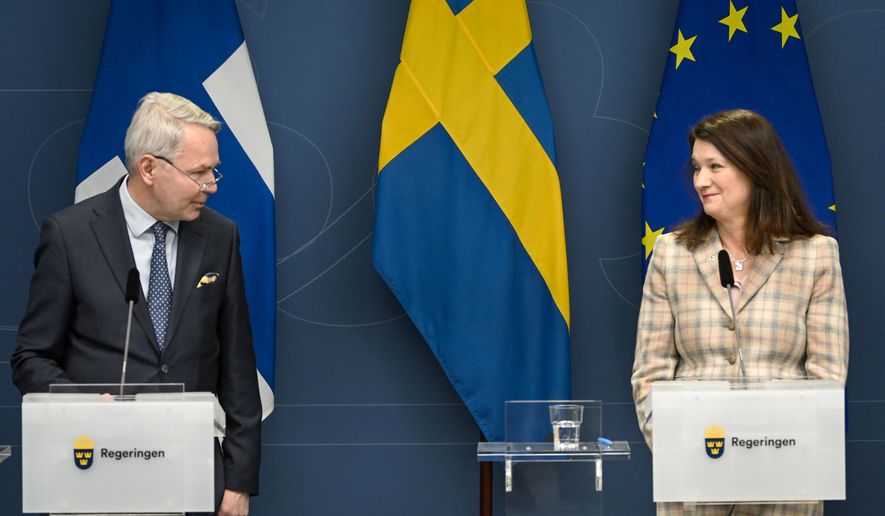 Finland&#x27;s Minister for Foreign Affairs Pekka Haavisto, left and his Swedish counterpart Ann Linde take part in a joint press conference with Sweden&#x27;s Defence Minister Peter Hultqvist, and his Finnish counterpart Antti Kaikkonen, in Stockholm, Sweden, Feb. 2, 2022, after talks on European security. Throughout the Cold War and in the decades since it ended, nothing could persuade Finns and Swedes that they would be better off joining NATO, until now. Russia’s invasion of Ukraine has profoundly changed Europe’s security outlook, including for Nordic neutrals Finland and Sweden, where support for joining NATO has surged to record levels. (Anders Wiklund, TT News Agency via AP) **FILE**