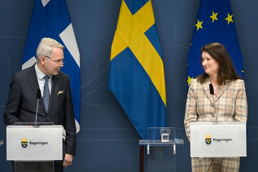 Finland&#x27;s Minister for Foreign Affairs Pekka Haavisto, left and his Swedish counterpart Ann Linde take part in a joint press conference with Sweden&#x27;s Defence Minister Peter Hultqvist, and his Finnish counterpart Antti Kaikkonen, in Stockholm, Sweden, Feb. 2, 2022, after talks on European security. Throughout the Cold War and in the decades since it ended, nothing could persuade Finns and Swedes that they would be better off joining NATO, until now. Russia’s invasion of Ukraine has profoundly changed Europe’s security outlook, including for Nordic neutrals Finland and Sweden, where support for joining NATO has surged to record levels. (Anders Wiklund, TT News Agency via AP) **FILE**