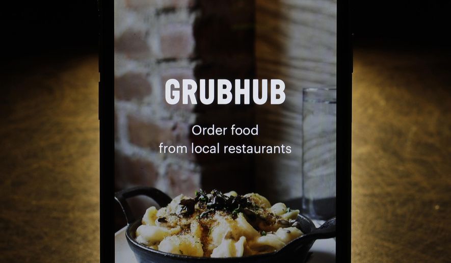 This Feb. 20, 2018, photo shows the Grubhub app on an iPhone in Chicago. (AP Photo/Charles Rex Arbogast) **FILE**