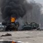 A Russian armored personnel carrier burns amid damaged and abandoned light utility vehicles after fighting in Kharkiv, Ukraine, Sunday, Feb. 27, 2022. The city authorities said that Ukrainian forces engaged in fighting with Russian troops that entered the country&#39;s second-largest city on Sunday. (AP Photo/Marienko Andrew)