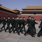 Chinese soldiers march past the Forbidden City on Friday, March 4, 2022, in Beijing. As China&#39;s 3,000-member ceremonial parliament prepare to open its annual session Saturday, March 5, 20222, China&#39;s defense budget, largely oriented toward possible military action in Taiwan, is another marquee item that is scrutinized closely by Congress watchers. (AP Photo/Ng Han Guan)