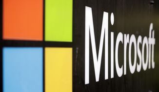 The Microsoft company logo is displayed at their offices in Sydney, Australia, on Wednesday, Feb. 3, 2021. (AP Photo/Rick Rycroft, File)