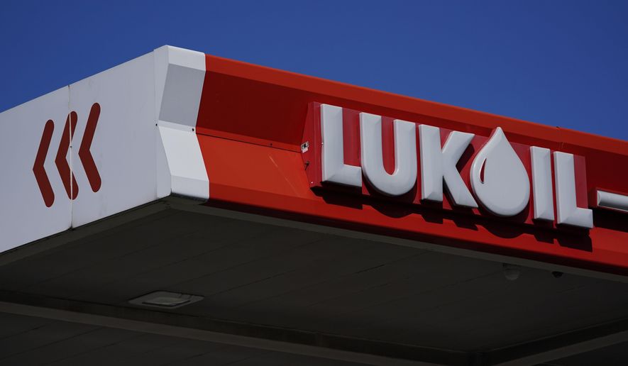 A Lukoil gas station sits in Newark, N.J., Thursday, March 3, 2022. Outraged by the invasion of Ukraine, the Newark City Council voted unanimously Wednesday to suspend the service stations’ operating licenses, citing Lukoil’s base in Moscow. In doing so, however, they may have predominantly been hurting Americans.  (AP Photo/Seth Wenig)