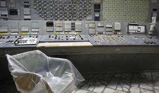 An operator&#39;s arm-chair covered with plastic sits in an empty control room of the 3rd reactor at the Chernobyl nuclear plant, in Chernobyl, Ukraine, on April 20, 2018. Russia’s attack on a nuclear power plant in Ukraine has revived the fears of people across Europe who remember the 1986 Chernobyl disaster. (AP Photo/Efrem Lukatsky, File)