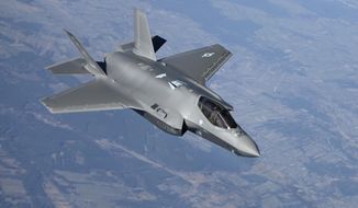 In this image provided by the U.S. Air Force, a U.S. Air Force F-35 Lightning II aircraft assigned to the 34th Fighter Squadron, departs from a KC-10 Extender aircraft after receiving fuel over Poland, on Feb. 24, 2022, as it flies in support of North Atlantic Treaty Organization enhanced air policing missions. Russia&#x27;s attack on Ukraine&#x27;s Zaporizhzhia nuclear power plant has renewed calls for NATO to impose a no-fly zone over Ukraine, despite the repeated rejection of the idea by western leaders concerned about triggering a wider war in Europe. (Senior Airman Joseph Barron/U.S. Air Force via AP)