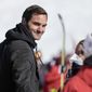 Switzerland&#39;s Roger Federer walks in the finish area of an alpine ski, women&#39;s World Cup super-G, in Lenzerheide, Switzerland, Saturday, March 5, 2022. (AP Photo/Giovanni Auletta)