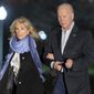President Joe Biden and first lady Jill Biden walk from Marine One upon arrival on the South Lawn of the White House, Sunday, March 6, 2022, in Washington. Biden is returning from Delaware. (AP Photo/Alex Brandon)